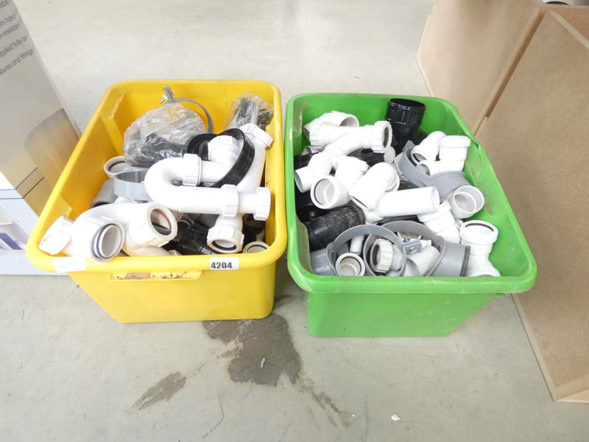 2 plastic boxes of plumbing fittings