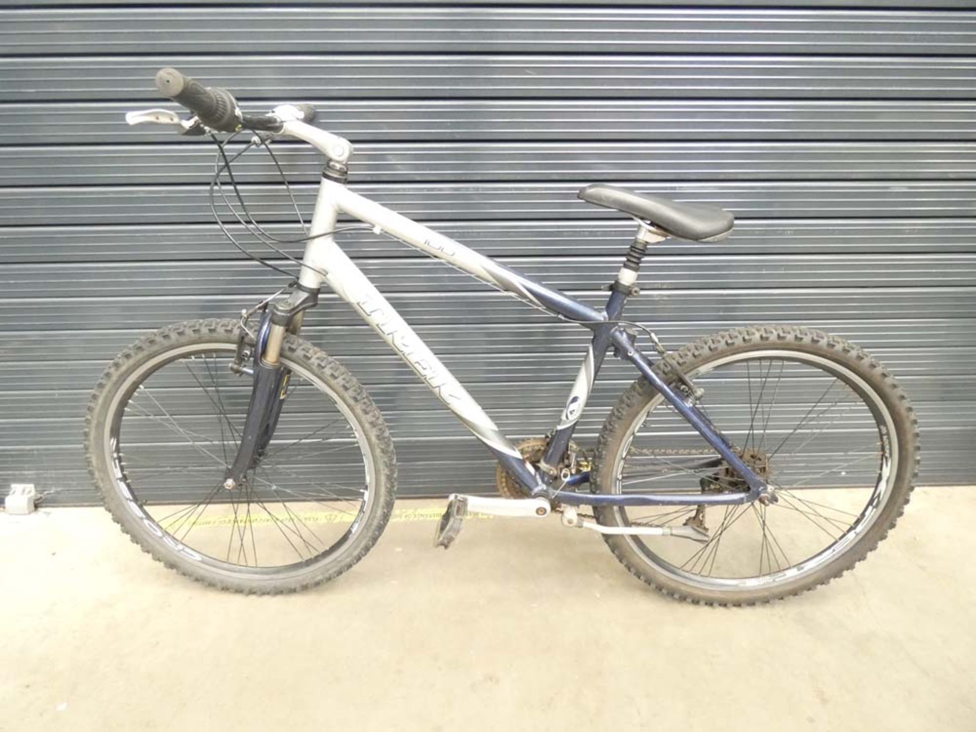 Silver and blue Trek mountain bike