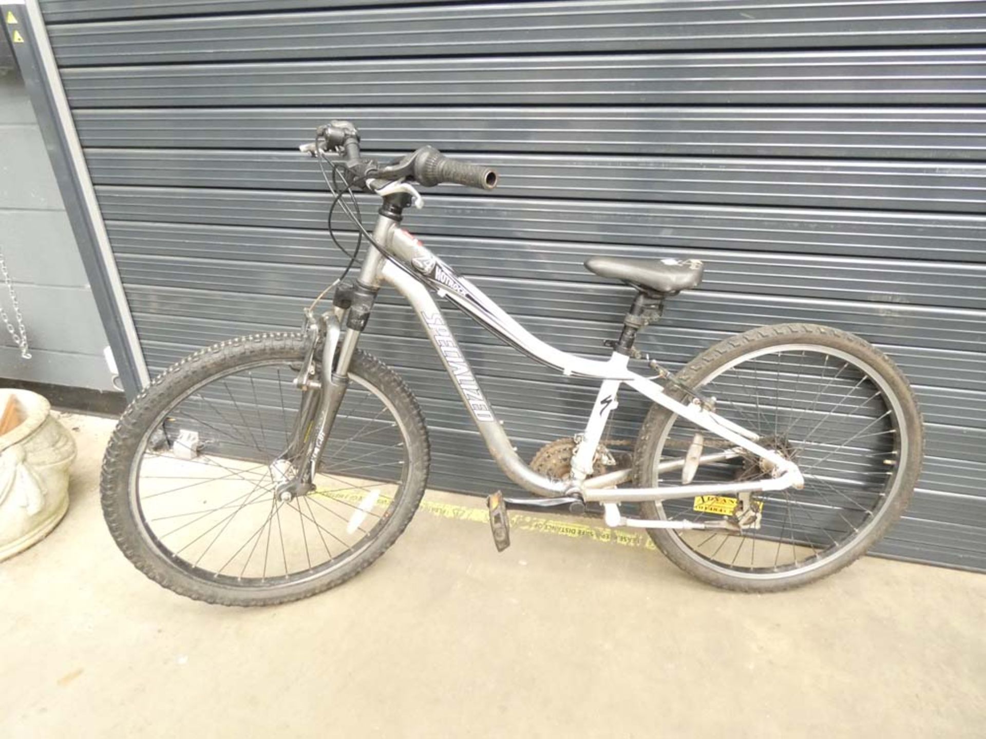 Grey and white specialised mountain bike