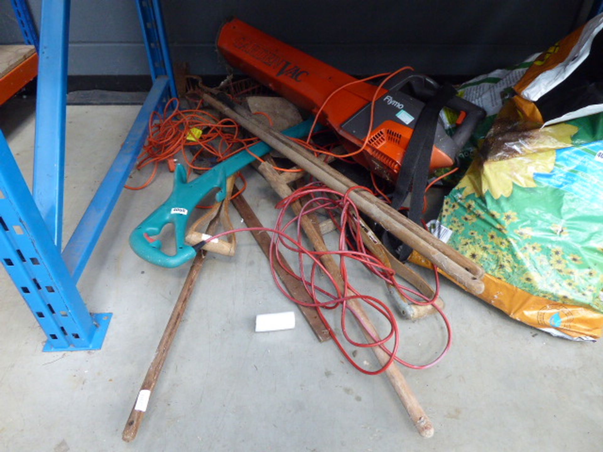 Half a bay of assorted tools inc. leaf blower, strimmer, etc