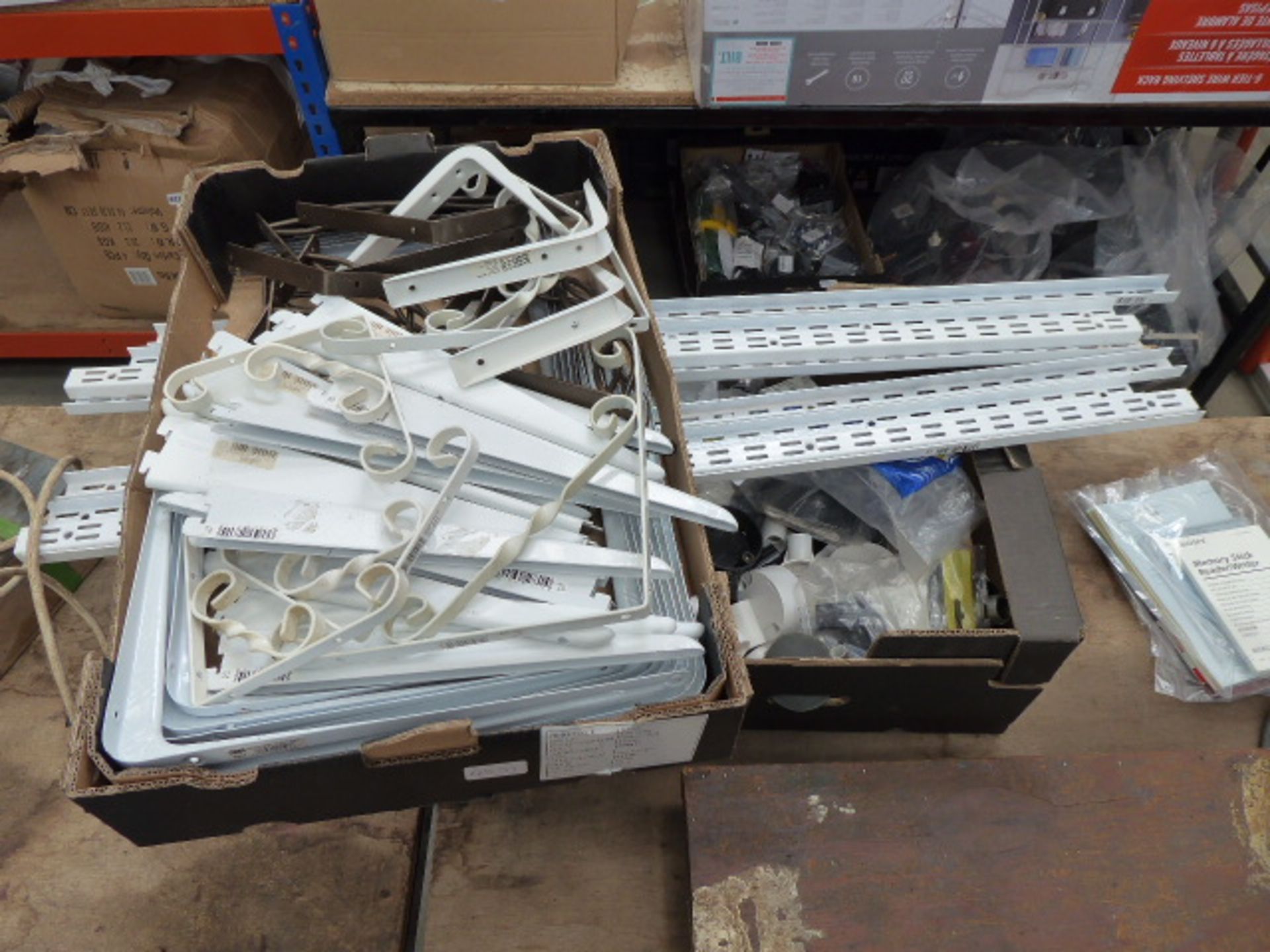 Box of shelf brackets and box of electrical fittings