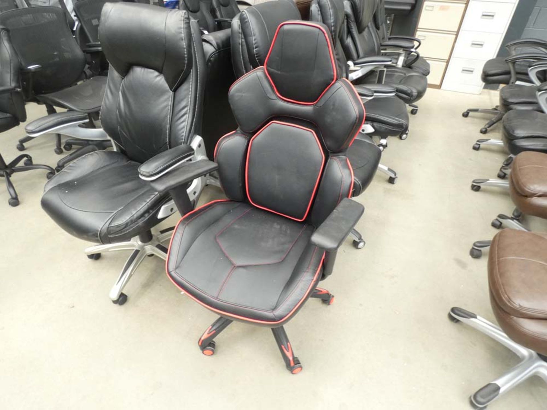 Black and red high backed racing style swivel armchair
