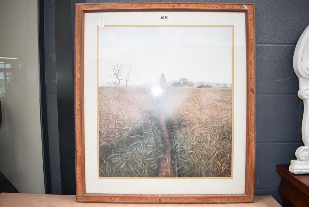 Large framed and glazed print of a female walking through a barley field