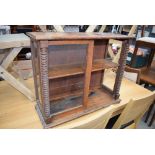 Oak single door table top cabinet with turned supports