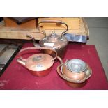 A collection of 3 copper kettles