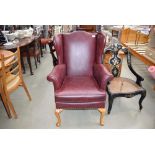 Faux red leather wingback chair by Parker Knoll