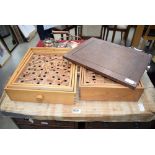 Boxed bagatelle board plus 2 other wooden puzzle games and a wooden frame