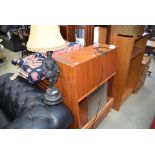 Part glazed bookcase plus a spelter table lamp modelled as Sir Walter Raleigh and a Lloyd Loom