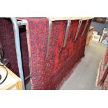 Large red ground geometric patterned rug