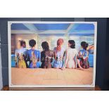 A framed print of Pink Floyd's back catalogue depicted by 6 females sitting on the edge of a