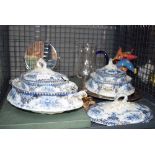 Cage of blue and white tureens, shaving mirror, glass jug, placemats etc