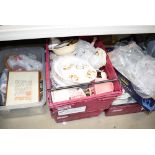 Six boxes of various china and glassware, held under a table