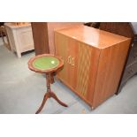 Small reproduction wine table together with a collection of LP's in a teak cabinet