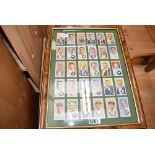 2 framed and glazed collections of cigarette cards featuring cricketers and footballers