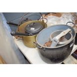 Collection of brass preserving pans a meat press and other cooking pots