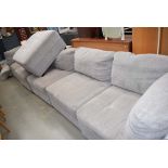 Large grey fabric covered sofa and stool