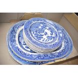 Box of blue and white Willow pattern plates and platters