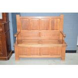 Oak lidded bench with panel back