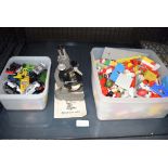 Cage of small quantity of Lego, small diecast Matchbox toys and a small microscope