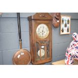 Wall mounted clock in oak frame