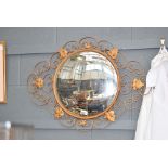 Circular metal framed mirror