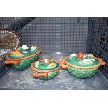 Three tellurite Art Deco pots and covers in green with vegetable decorations