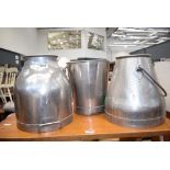 2 stainless steel milk churns and a stainless steel milk bucket