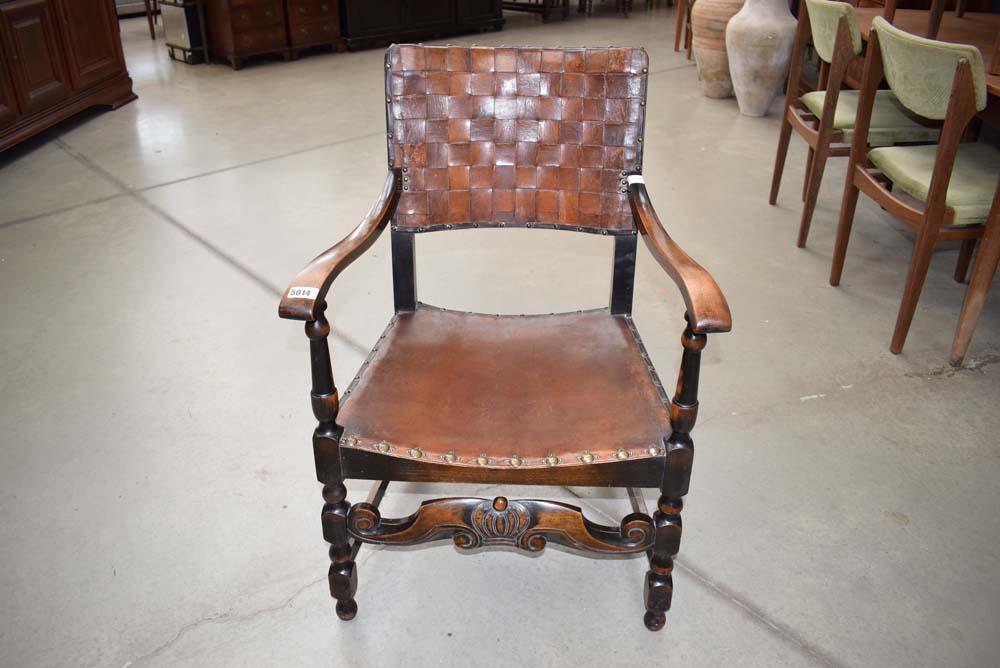 Leather seated and backed armchair on beech frame