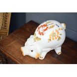 Large piggy bank with floral decoration