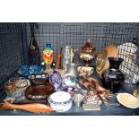 Cage of glassware, metalwares to include a glass clown, large tankered glass bottles, a fish