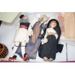 Small bag of dolls in national dress