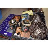 Box of metalwares, tins, china, wood carvings together with a boxed game 2000AD and Spy King