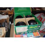 2 boxed pair sets of lawn bowls together with a bag of lawn bowls