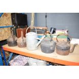 Quantity of cast and tin tea pots together with a watering can