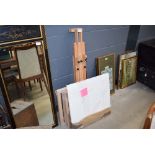 Modern easel together with a set of frames and mounting boards