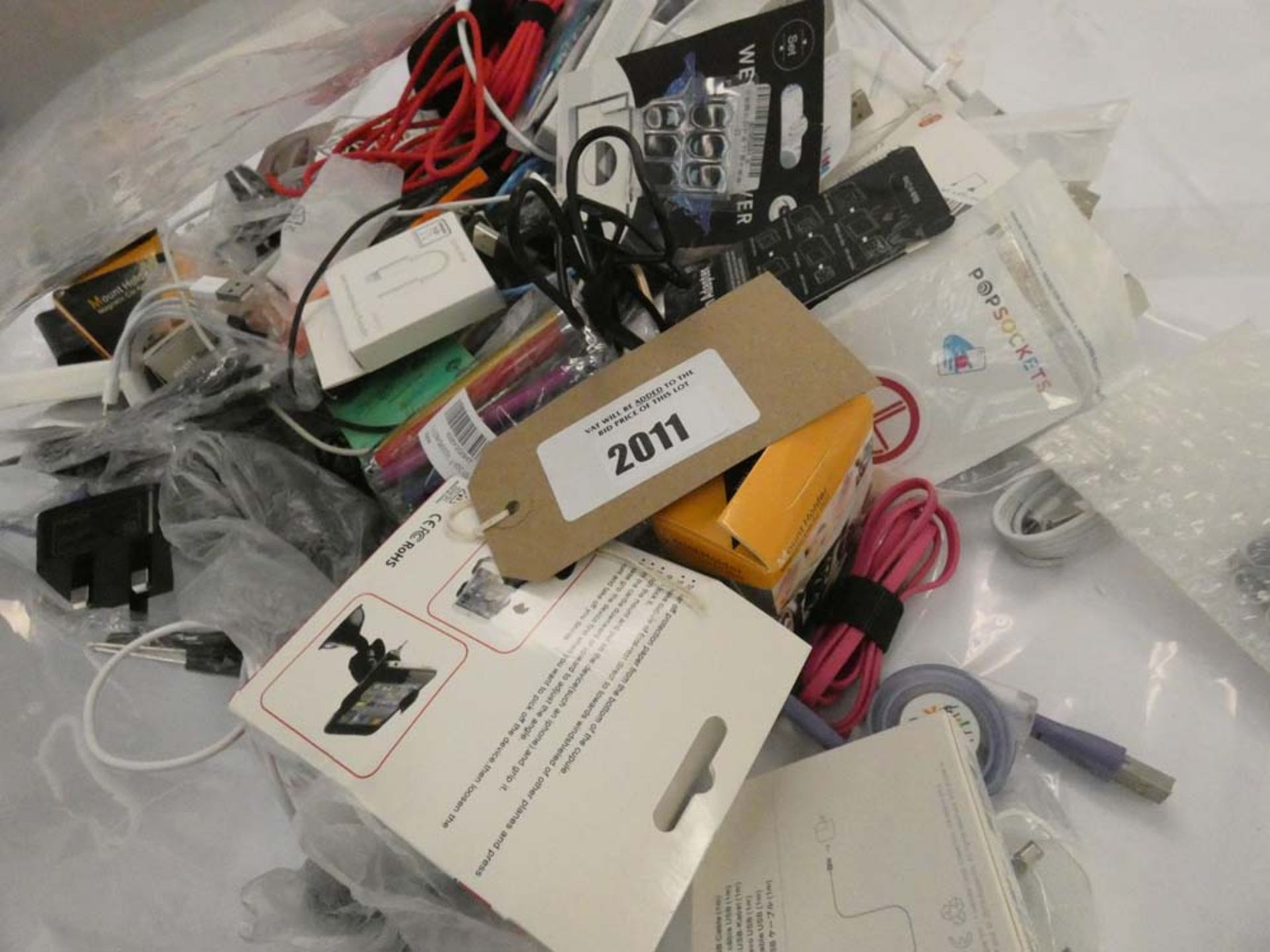 Bag containing quantity of various mobile phone accessories; leads, adapters, spare phone screens,