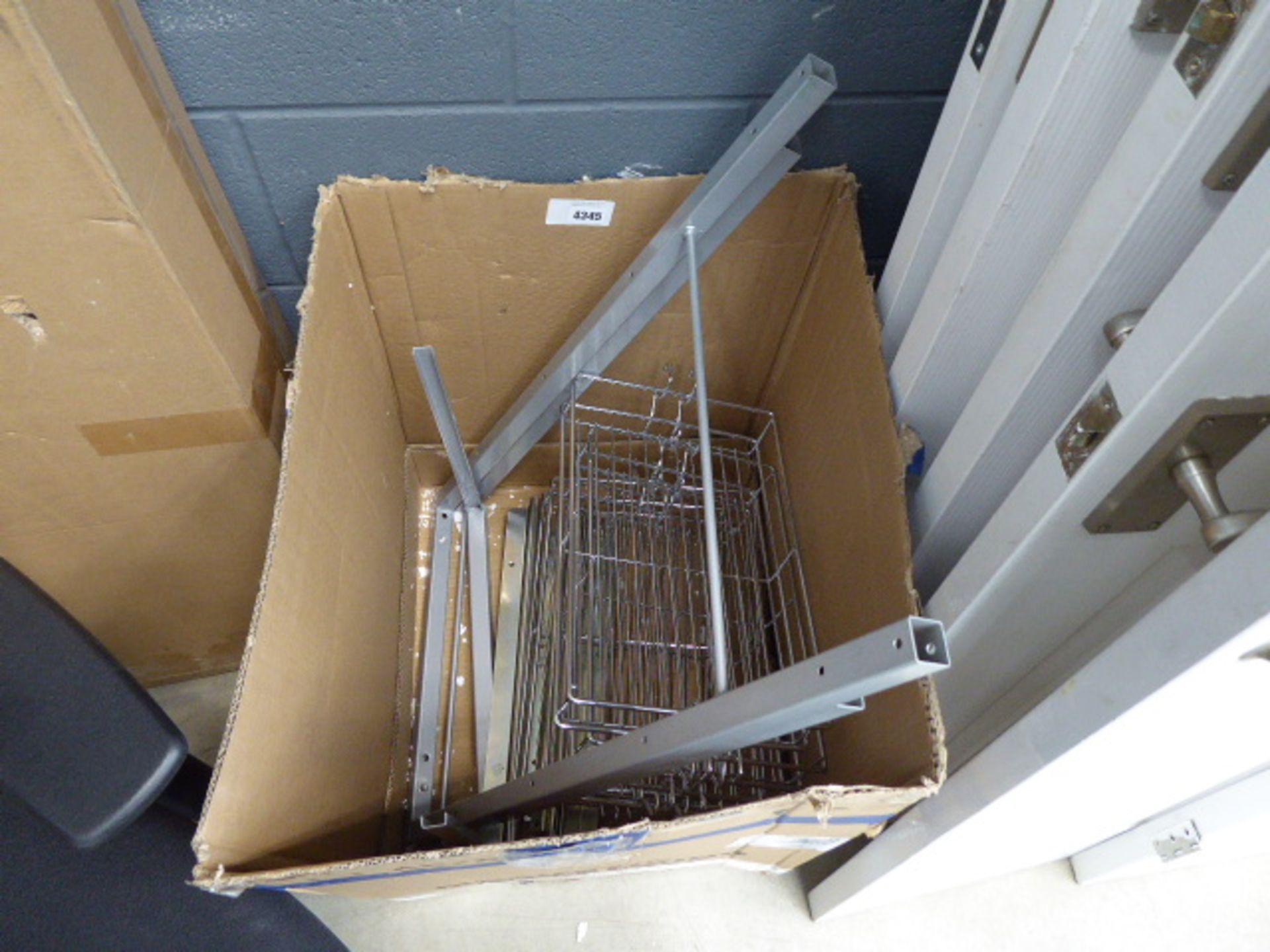 Box containing a quantity of chrome baskets