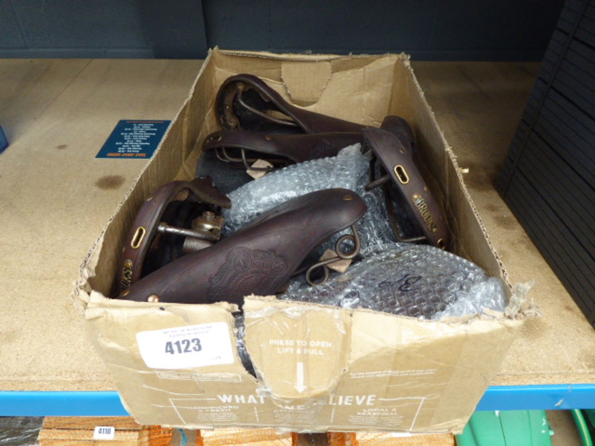 Box of Brooks bike seats