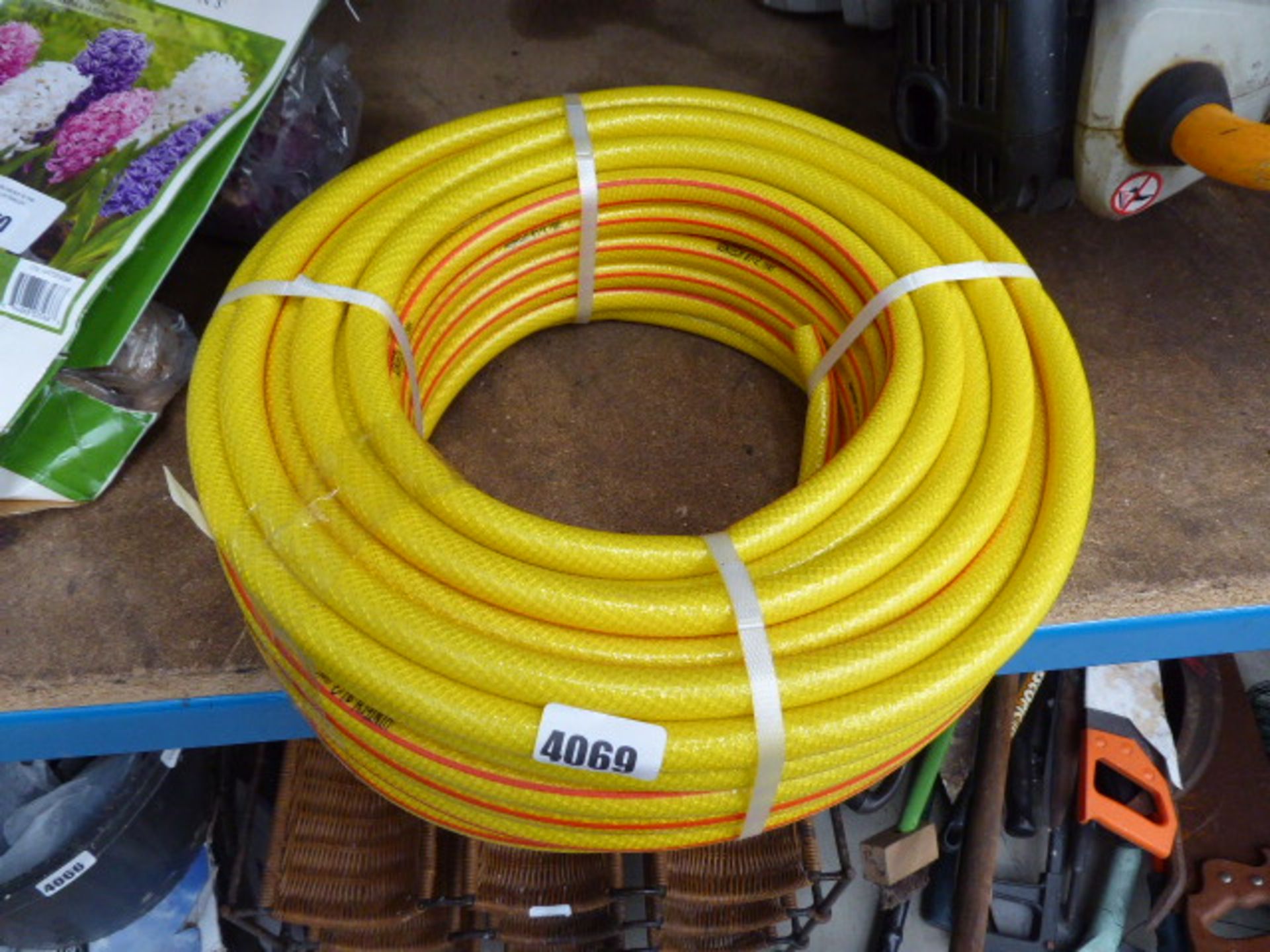 Small roll of yellow hose