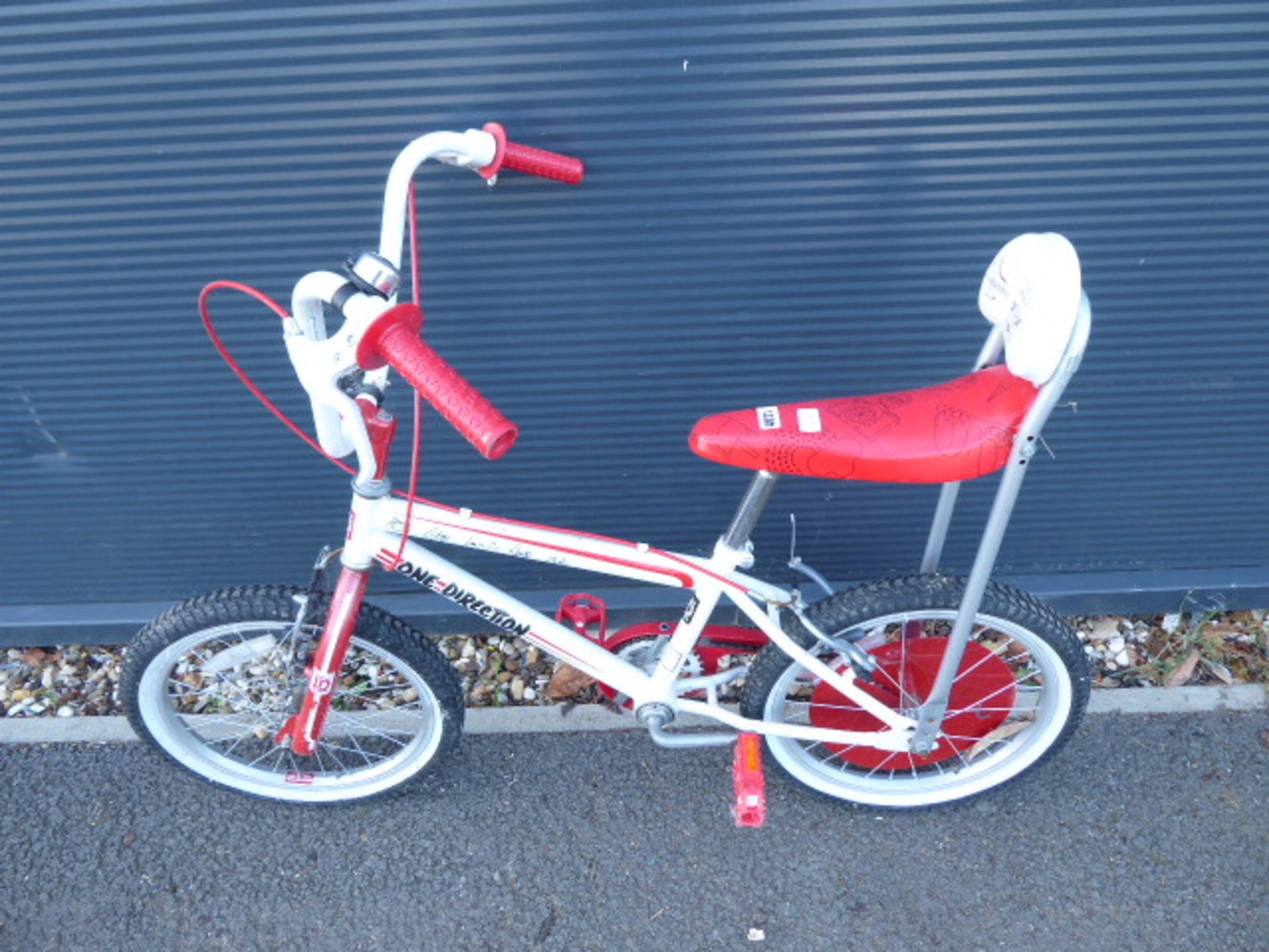 Red and white One Direction child's cycle
