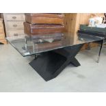 Glazed coffee table with black painted X shaped base