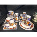 A cage containing a quantity of Vileroy & Boch Acapulco pattern crockery