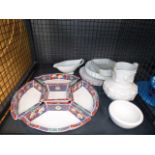 (Lot 5629 2037). A cage containing: flan dishes, entree dishes, a gravy boat and a water jug