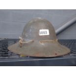 A tin military helmet