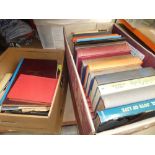 Two boxes containing a quantity of novels