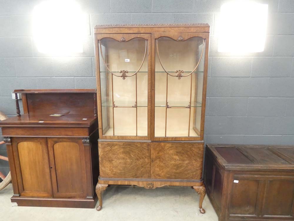 Glazed walnut double door china cabinet on cabriole supports