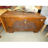 Heavily carved Chinese camphor blanket box