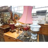 Two maroon pottery and brass table lamps plus two glass table lamps