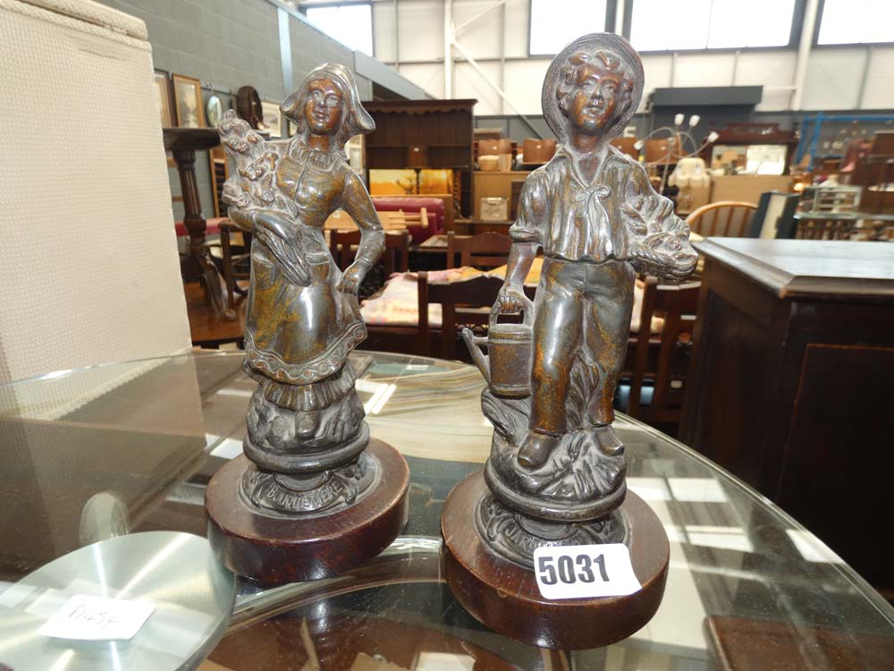 Pair of French bronze figures peasant girl and gardener