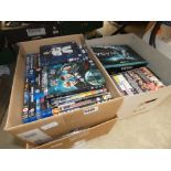 3 boxes containing DVDs